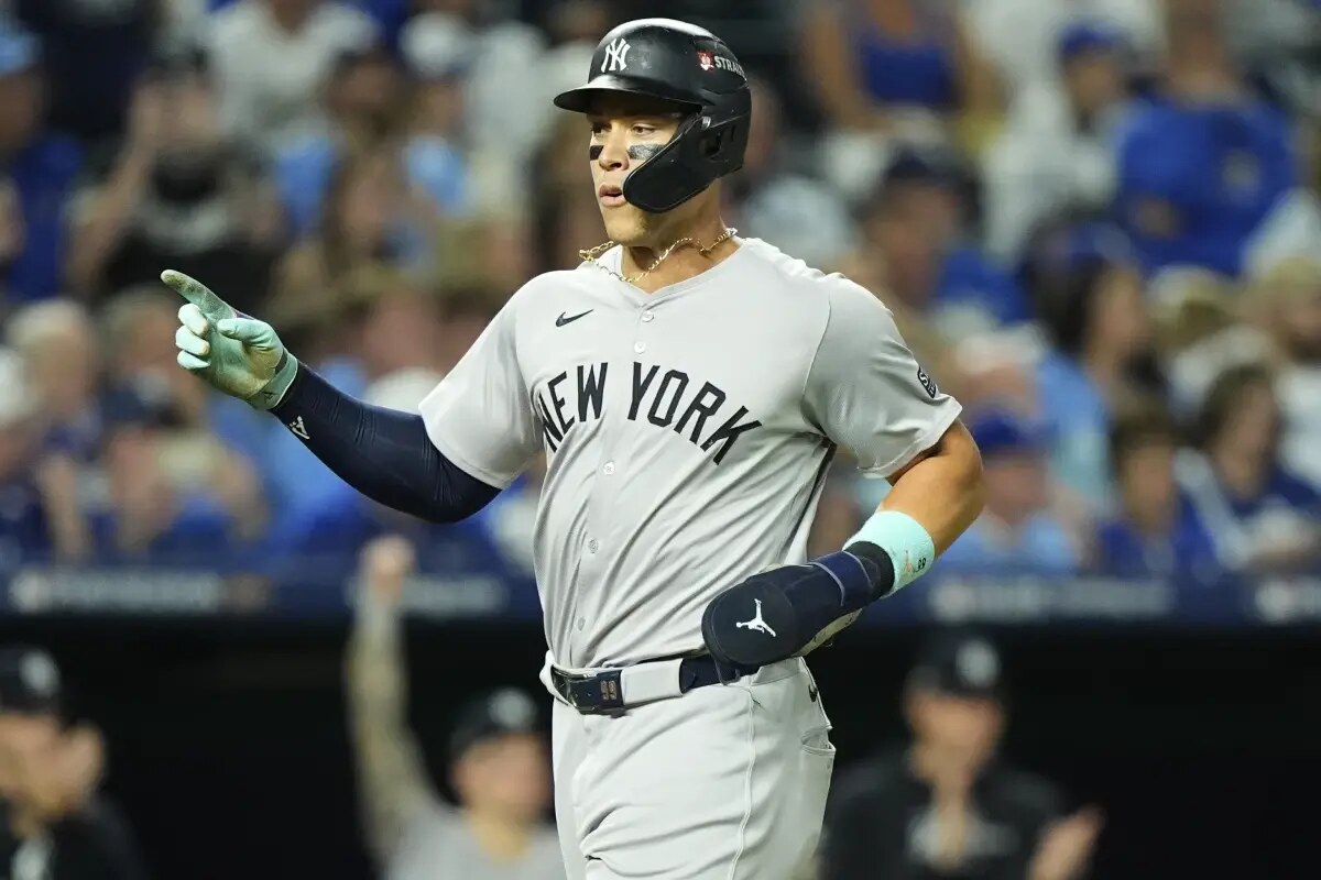 New York Yankees’ Aaron Judge celebrates as he scores during the sixth inning in Game 4 of an American League Division baseball playoff series against the Kansas City Royals Thursday, Oct. 10, 2024, in Kansas City, Mo.