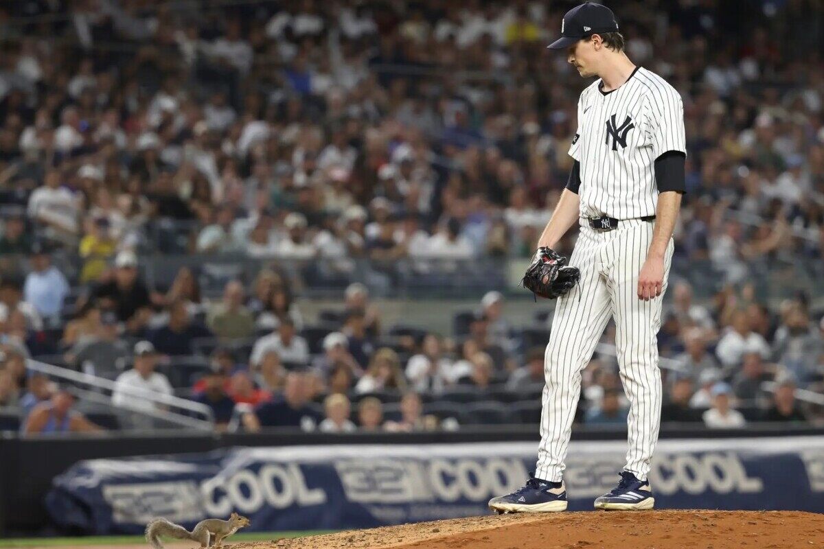 New York Yankees pitcher Max Fried watches a squirrel on the field during the fourth inning of a baseball game against the Boston Red Sox, Friday, Aug. 22, 2025, in New York.
