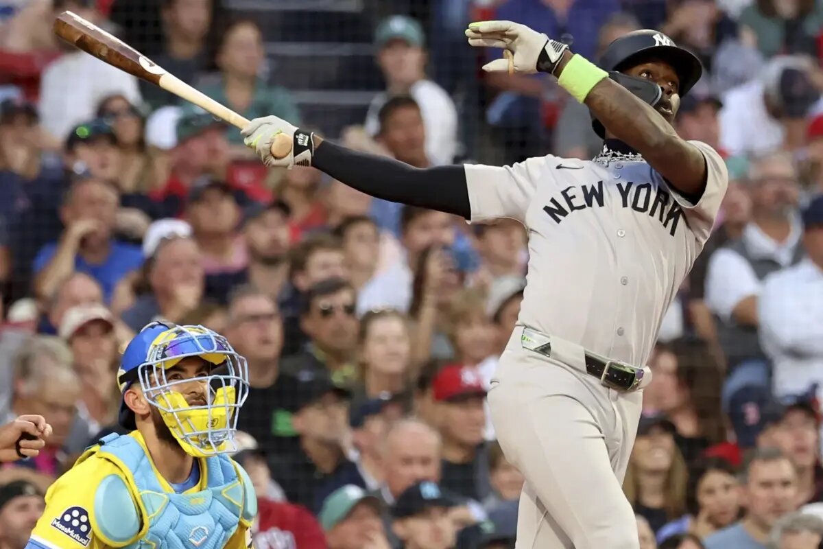 New York Yankees’ Jazz Chisholm Jr., right, watches his home run during the fifth inning of a baseball game against the Boston Red Sox, Saturday, Sept. 13, 2025, in Boston.