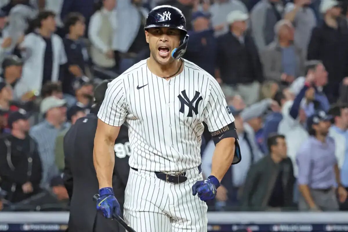 Giancarlo Stanton #27 of the New York Yankees reacts after he hits a double during the second inning.