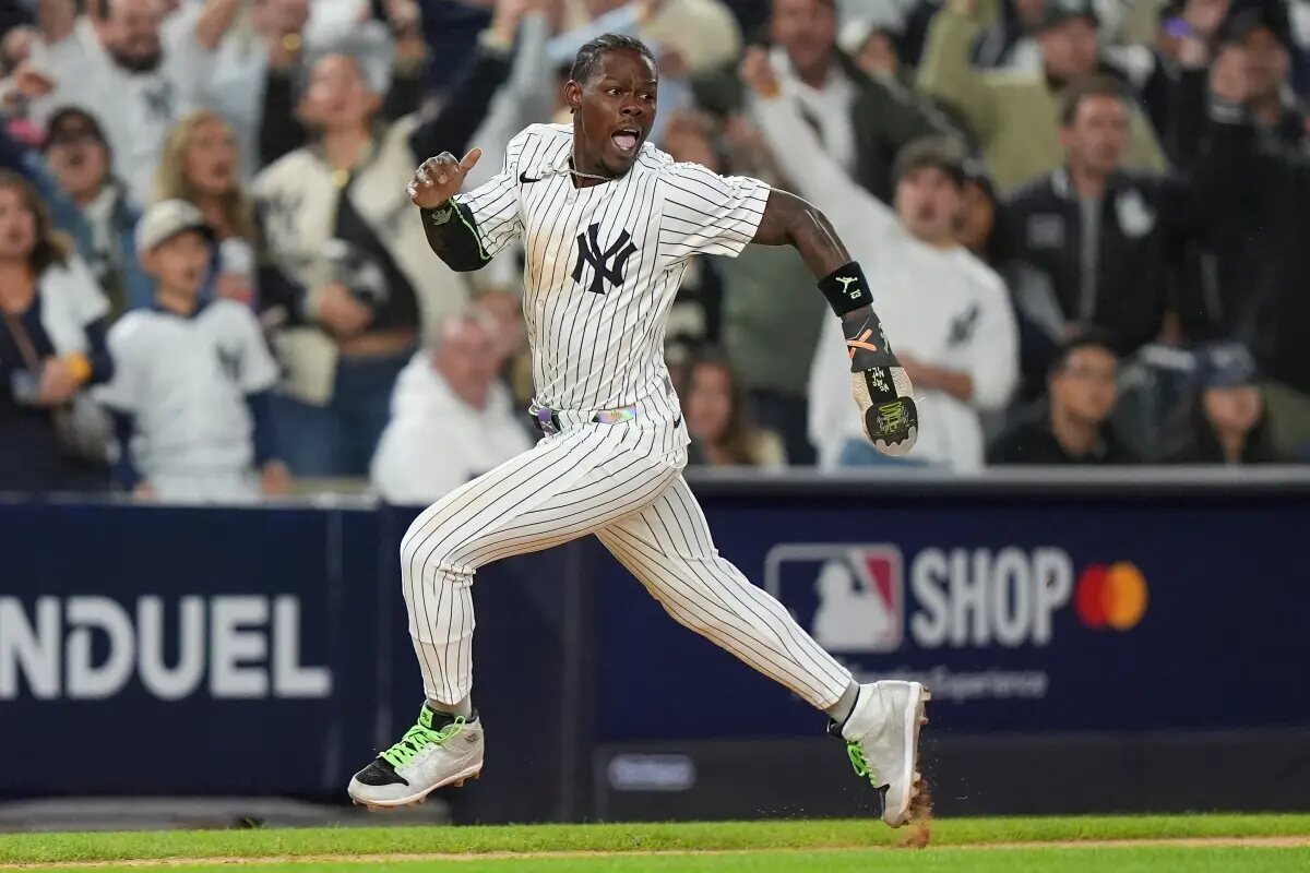New York Yankees Jazz Chisholm Jr. rounds third base on his way home to score on a base hit by Austin Wells against the Boston Red Sox during the eighth inning of Game 2 of an American League wild-card baseball playoff series, Wednesday, Oct. 1, 2025, in New York.