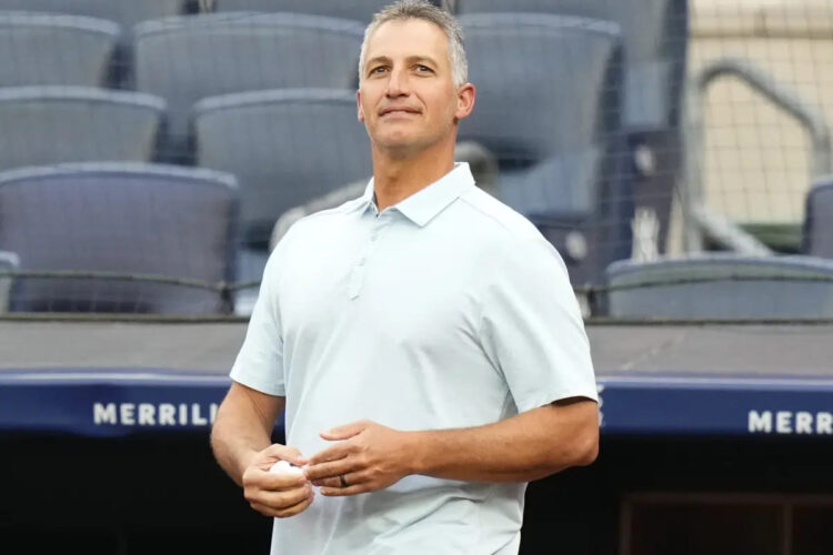 Former New York Yankees pitcher Andy Pettitte walks on the field to throw out a ceremonial first pitch before a baseball game between the Yankees and the New York Mets, Tuesday, July 25, 2023, in New York.