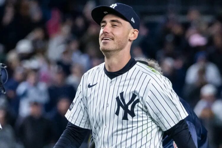 Cody Bellinger #35 of the New York Yankees is all smiles after making a diving catch.