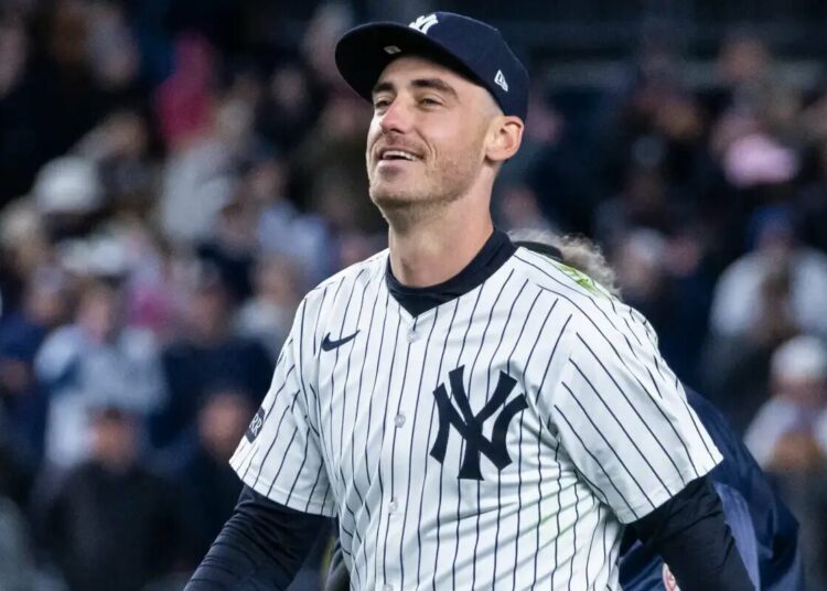 Cody Bellinger #35 of the New York Yankees is all smiles after making a diving catch.