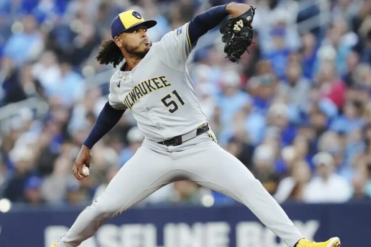 Milwaukee Brewers pitcher Freddy Peralta (51) works against the Toronto Blue Jays during first inning MLB baseball action in Toronto on Friday, August 29, 2025.