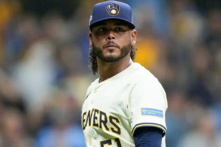 Milwaukee Brewers pitcher Freddy Peralta walks to the dugout after the top of the fifth inning in Game 2 of baseball’s National League Championship Series against the Los Angeles Dodgers, Tuesday, Oct. 14, 2025, in Milwaukee.