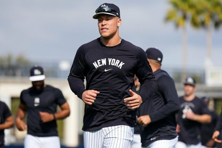 Captain Aaron Judge leads his Yankees teammates during an excercise session at the spring training camp in Tampa, Fl. Feb. 13, 2026.