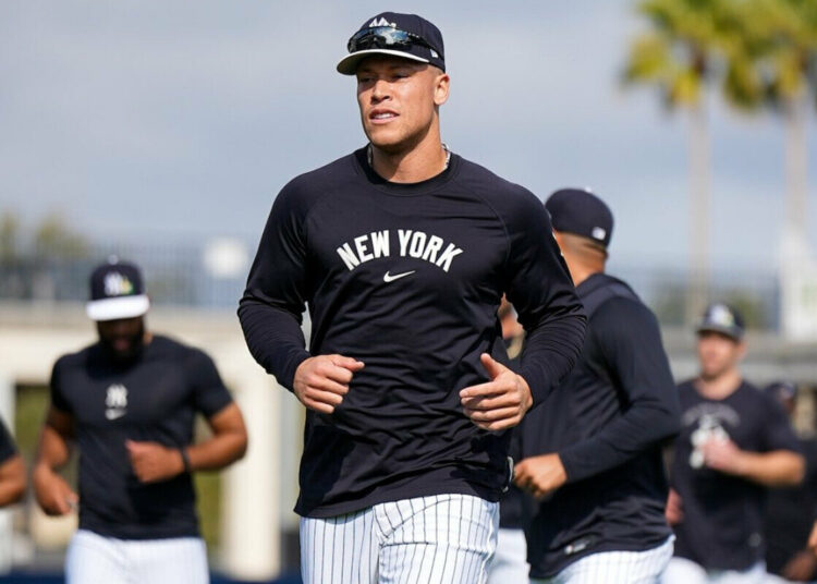 Captain Aaron Judge leads his Yankees teammates during an excercise session at the spring training camp in Tampa, Fl. Feb. 13, 2026.