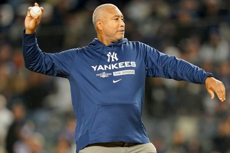 New York Yankees legend Bernie Williams throws out the ceremonial first pitch in 2022.