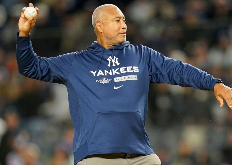 New York Yankees legend Bernie Williams throws out the ceremonial first pitch in 2022.