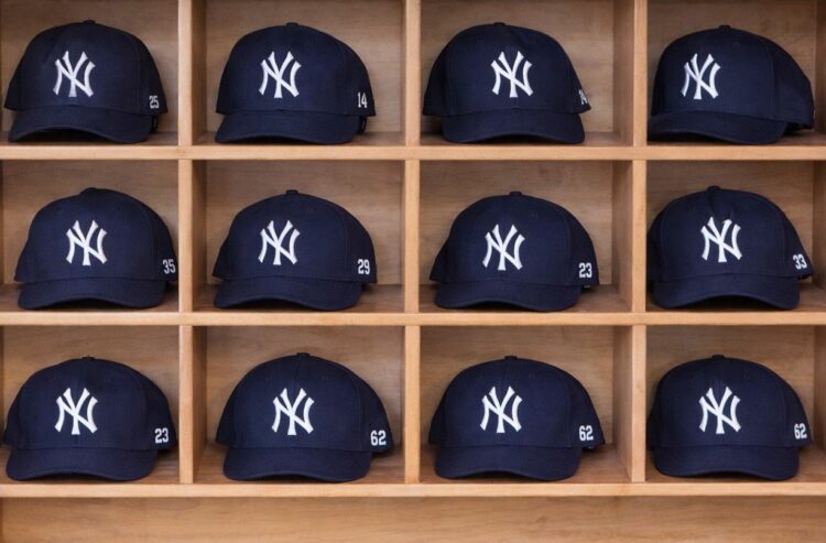 Rows of New York Yankees caps at a merchandise store in Japan.