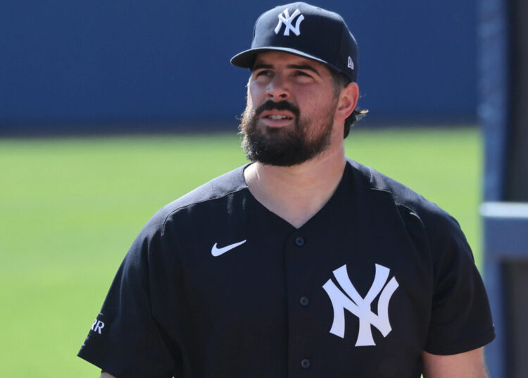 New York Yankees pitcher Carlos Rodón walking to the bullpen at Steinbrenner Field in Tampa, Florida.