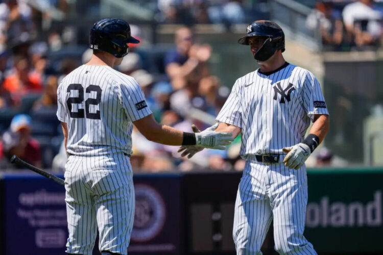 New York Yankees’ Paul Goldschmidt (48) celebrates with New York Yankees’ Ben Rice (22) after scoring during the first inning of a baseball game against the Houston Astros, Saturday, Aug. 9, 2025, in New York.
