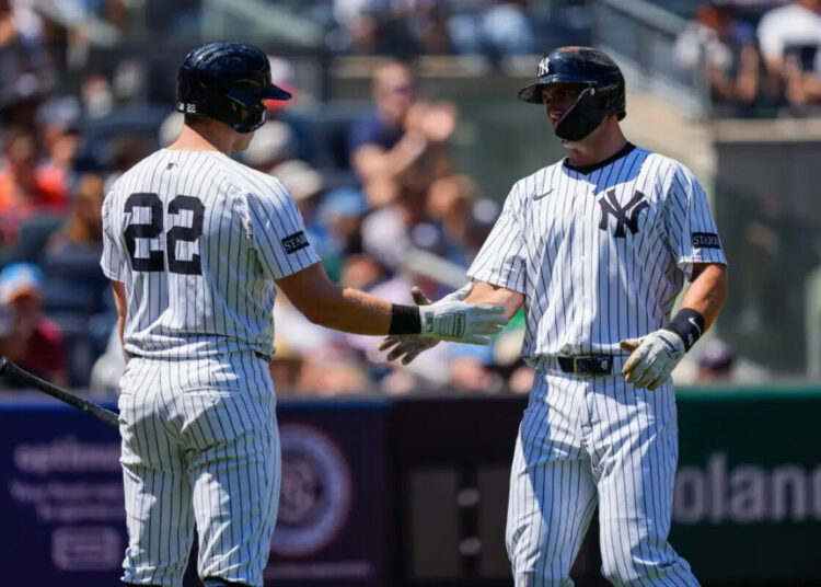 New York Yankees’ Paul Goldschmidt (48) celebrates with New York Yankees’ Ben Rice (22) after scoring during the first inning of a baseball game against the Houston Astros, Saturday, Aug. 9, 2025, in New York.