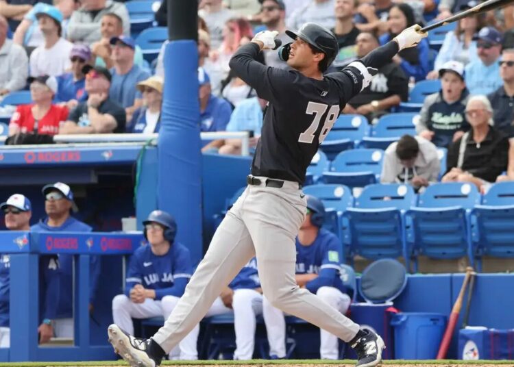 New York Yankees outfielder Spencer Jones #78, hitting a 2-run homer in the 6th inning of a Spring Training game on February 22, 2025.
