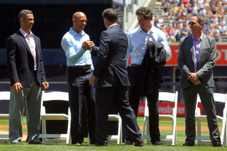 Jun 21, 2014; Bronx, NY, USA; New York Yankees former player Tino Martinez (center) greets (left to right) former teammates Jorge Posada and Mariano Rivera and Paul O'Neill and David Cone during a ceremony before a game against the Baltimore Orioles at Yankee Stadium.