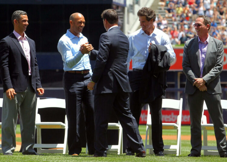 Jun 21, 2014; Bronx, NY, USA; New York Yankees former player Tino Martinez (center) greets (left to right) former teammates Jorge Posada and Mariano Rivera and Paul O'Neill and David Cone during a ceremony before a game against the Baltimore Orioles at Yankee Stadium.