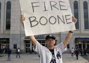 An undated image of a Yankees fan seeking dimissal of manager Aaron Boone in 2025.