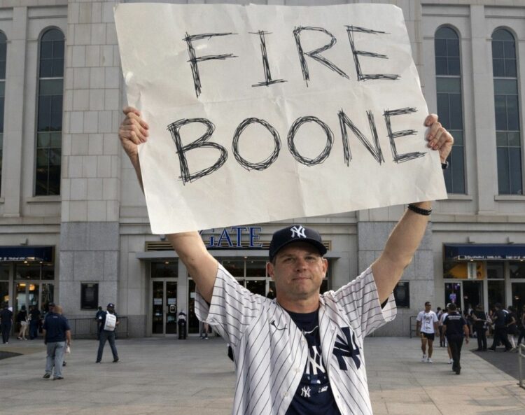 An undated image of a Yankees fan seeking dimissal of manager Aaron Boone in 2025.