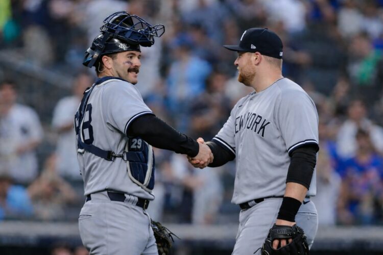 Yankees catcher Austin Wells celebrates with David Bednar after the 3-1 win over the Giants in San Francisco, March 28, 2026.