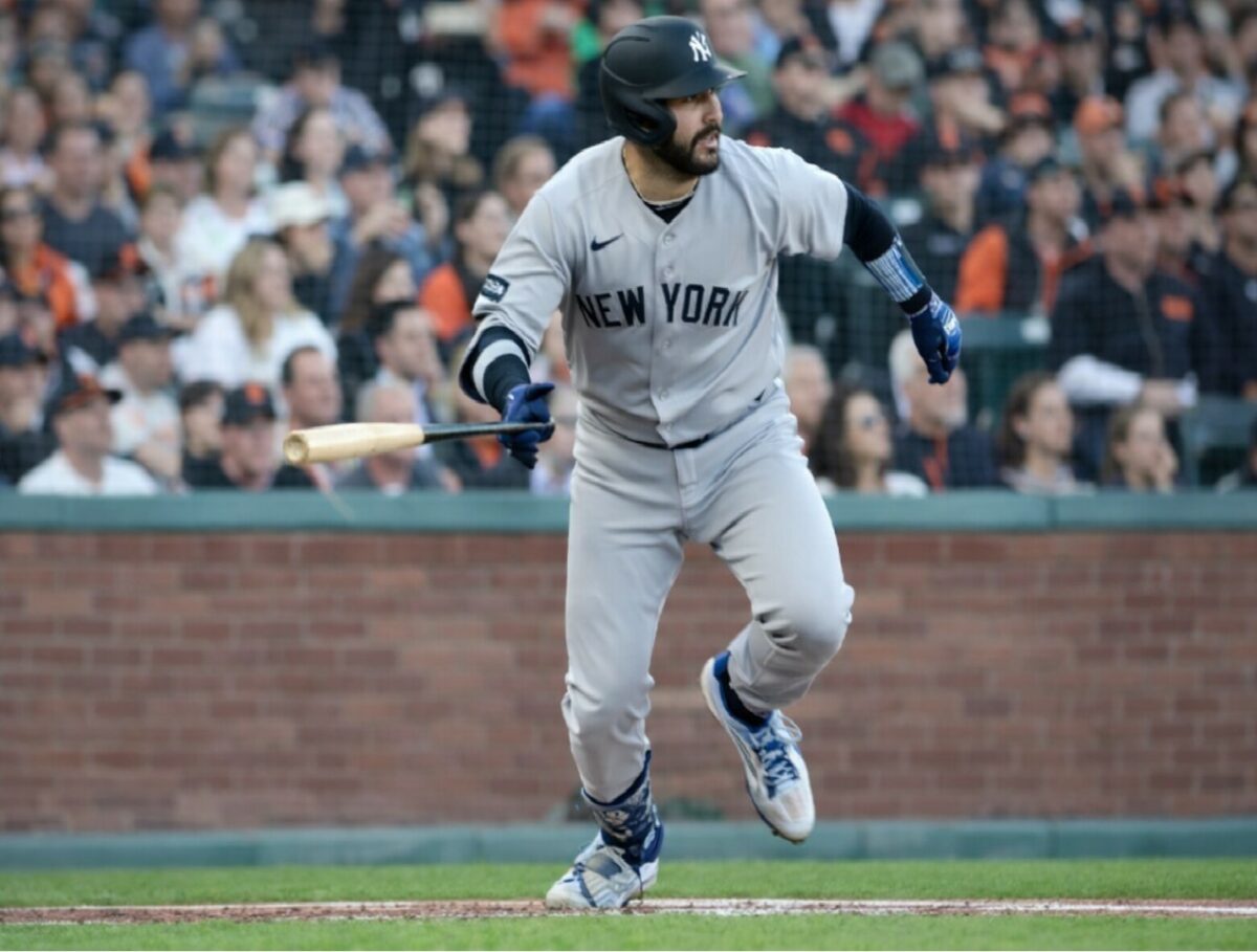 Austin Wells runs after a hit during the Yankees' 7-0 win over the Giants in San Francisco, March 25, 2026.
