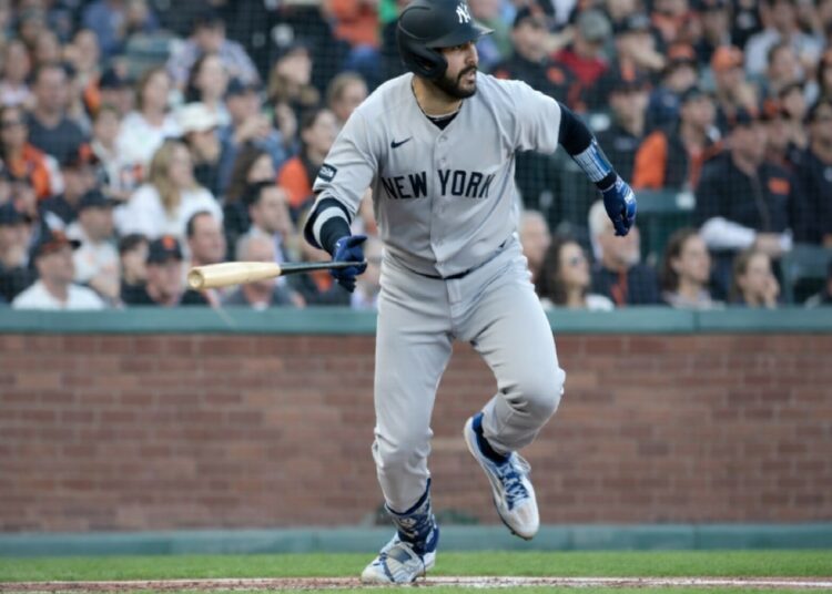 Austin Wells runs after a hit during the Yankees' 7-0 win over the Giants in San Francisco, March 25, 2026.