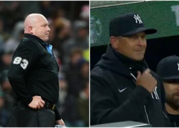 Mike Estabrook (83) reacts as New York Yankees’ Jazz Chisholm Jr. challenges a call during the fourth inning of a baseball game against the Seattle Mariners, Monday, March 30, 2026, in Seattle.
