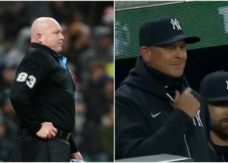 Mike Estabrook (83) reacts as New York Yankees’ Jazz Chisholm Jr. challenges a call during the fourth inning of a baseball game against the Seattle Mariners, Monday, March 30, 2026, in Seattle.