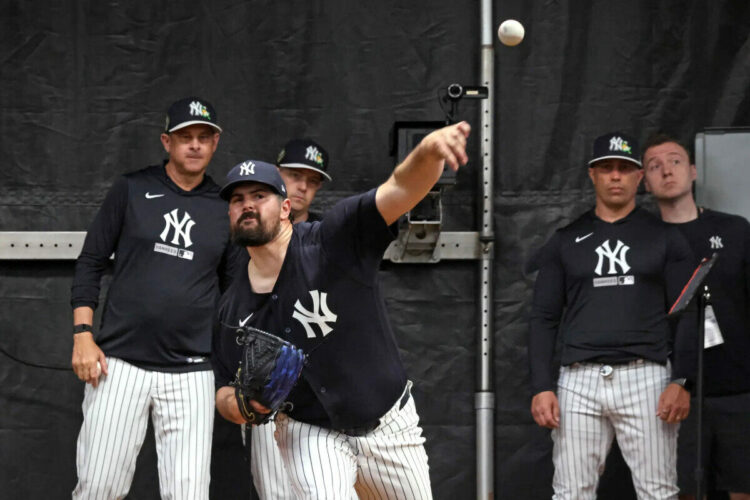 New York Yankees pitcher Carlos Rodón throwing in the bullpen during Saturday’s workout at Steinbrenner Field in Tampa, Florida.