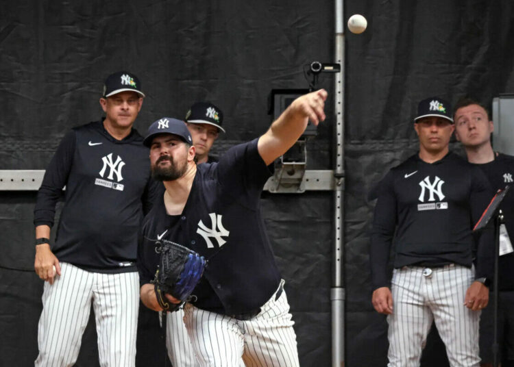 New York Yankees pitcher Carlos Rodón throwing in the bullpen during Saturday’s workout at Steinbrenner Field in Tampa, Florida.