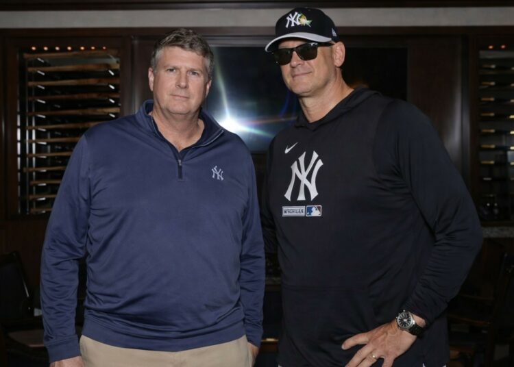 Yankees owner Hal Steinbrenner and manager Aaron Boone, March 2026.