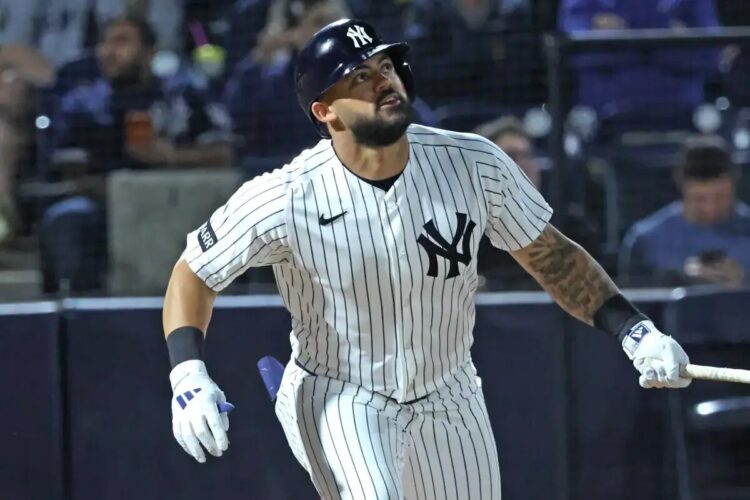 Jasson Domínguez takes a swing during a spring training game.