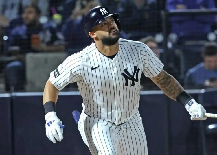 Jasson Domínguez takes a swing during a spring training game.