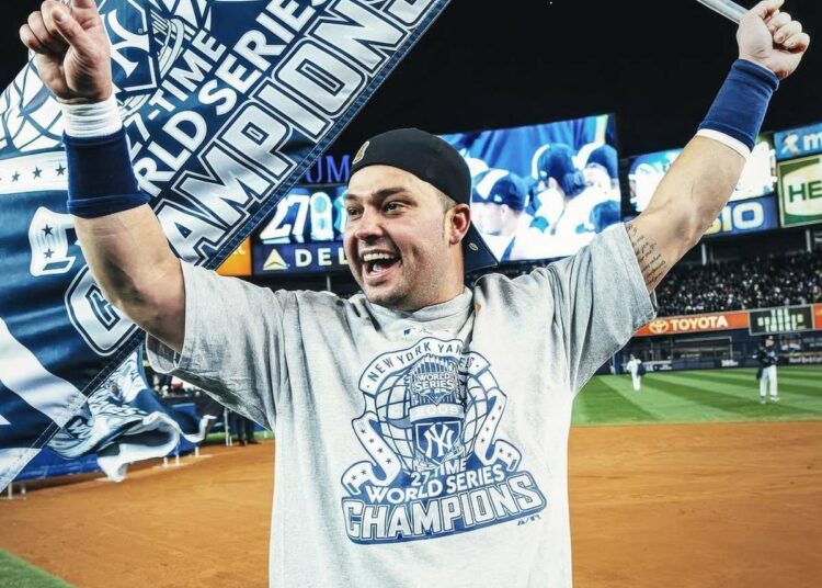 New York Yankees' Nick Swisher celebrates after the World Series win, Nov. 4, 2009, Yankee Stadium, New York.
