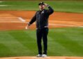 Former New York Yankees' Nick Swisher salutes the crowd before throwing out the ceremonial first pitch before Game 2 of the baseball AL Championship Series between the Cleveland Guardians and New York Yankees Tuesday, Oct. 15, 2024, in New York.