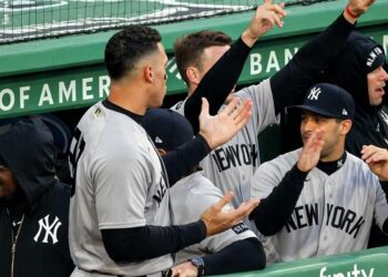 Aaron Judge celebrates in Yankees' dugout after Stanton's homer during the 4-0 win over the Red Sox in Boston, Apr. 21, 2026.