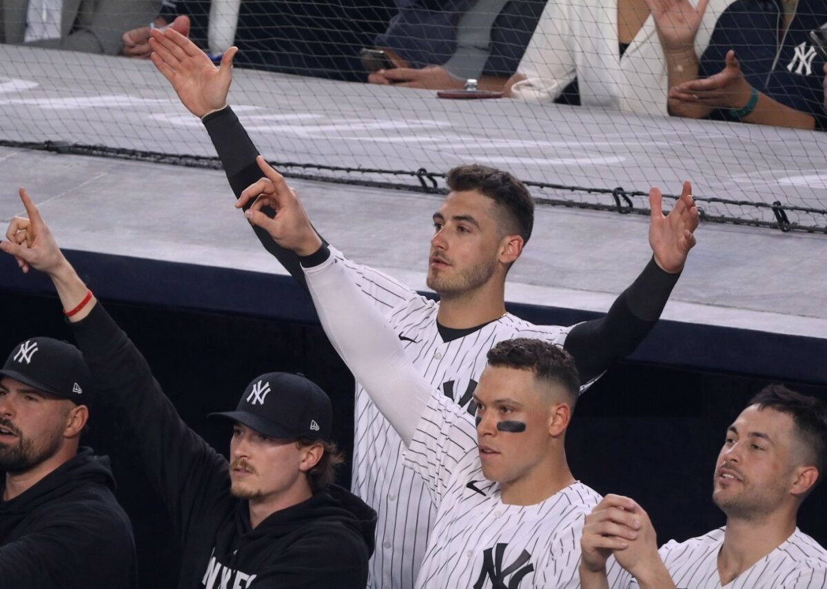 Yankees stars in the dugout react as Trent Grisham's home run gave them a lead in the 11-10 win over the Angels in New York, Apr. 13, 2026.