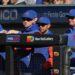 Mets manager Carlos Mendoza (64) in the dugout.
