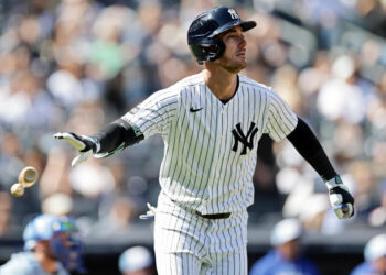 New York Yankees’ Cody Bellinger watches his two-run home run during the sixth inning of a baseball game against the Kansas City Royals, Saturday, April 18, 2026, in New York.