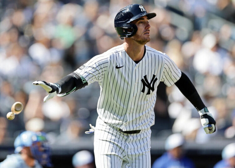 New York Yankees’ Cody Bellinger watches his two-run home run during the sixth inning of a baseball game against the Kansas City Royals, Saturday, April 18, 2026, in New York.