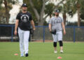 Yankees pitcher Gerrit Cole #45, (left) and New York Yankees pitcher Carlos Rodón #55, throwing on a back field as pitchers and catchers reported to Spring Training.