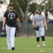 Yankees pitcher Gerrit Cole #45, (left) and New York Yankees pitcher Carlos Rodón #55, throwing on a back field as pitchers and catchers reported to Spring Training.