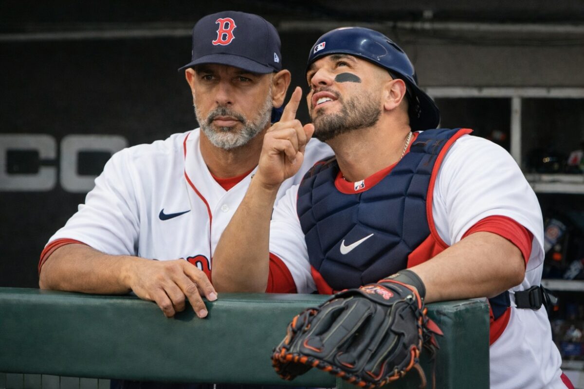 Boston Red Sox coach Alex Cora and their catcher Carlos Narvaez in 2026.