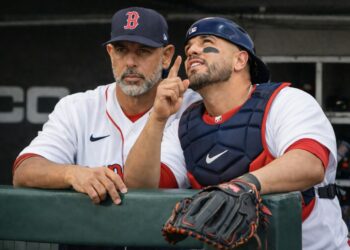 Boston Red Sox coach Alex Cora and their catcher Carlos Narvaez in 2026.