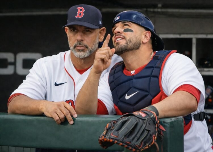 Boston Red Sox coach Alex Cora and their catcher Carlos Narvaez in 2026.