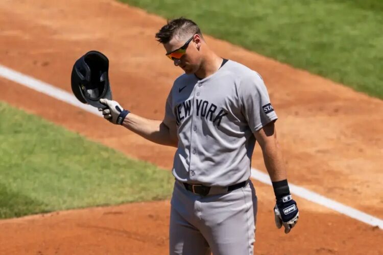 DJ LeMahieu of the New York Yankees reacts after he strikes out looking.