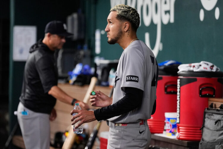 New York Yankees starting pitcher Elmer Rodriguez stands in the dugout after being pulled in the fifth inning of a baseball game against the Texas Rangers Wednesday, April 29, 2026, in Arlington, Texas.