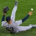 Fernanado Cruz made a back-hand throw while on the grass in the