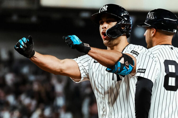 Giancarlo Stanton reacts after stealing a base in the Yankees' 9-7 win over the Marlins in New York, Apr. 4, 2026.