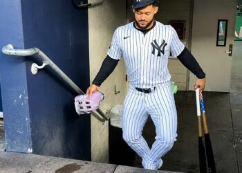 Yankees' Jasson Dominguez is making acomic walkthrough as he clim stairs at Yankee Stadium, 2025.